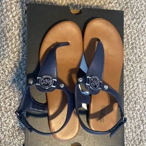 Gently used, size 4 Michael Kors Velcro sandals.